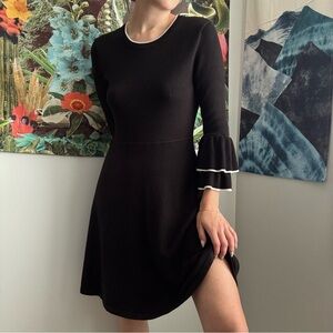 Black knit dress with ruffle sleeves